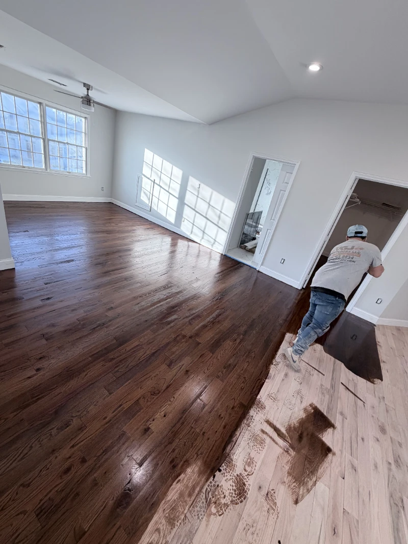 VGJ Floors Covering crew refinishing a hardwood floor