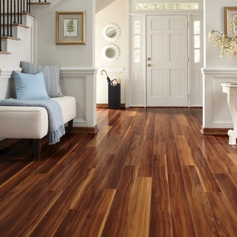 Glossy acacia-look plank in a styled entry hall, staircase to the left
